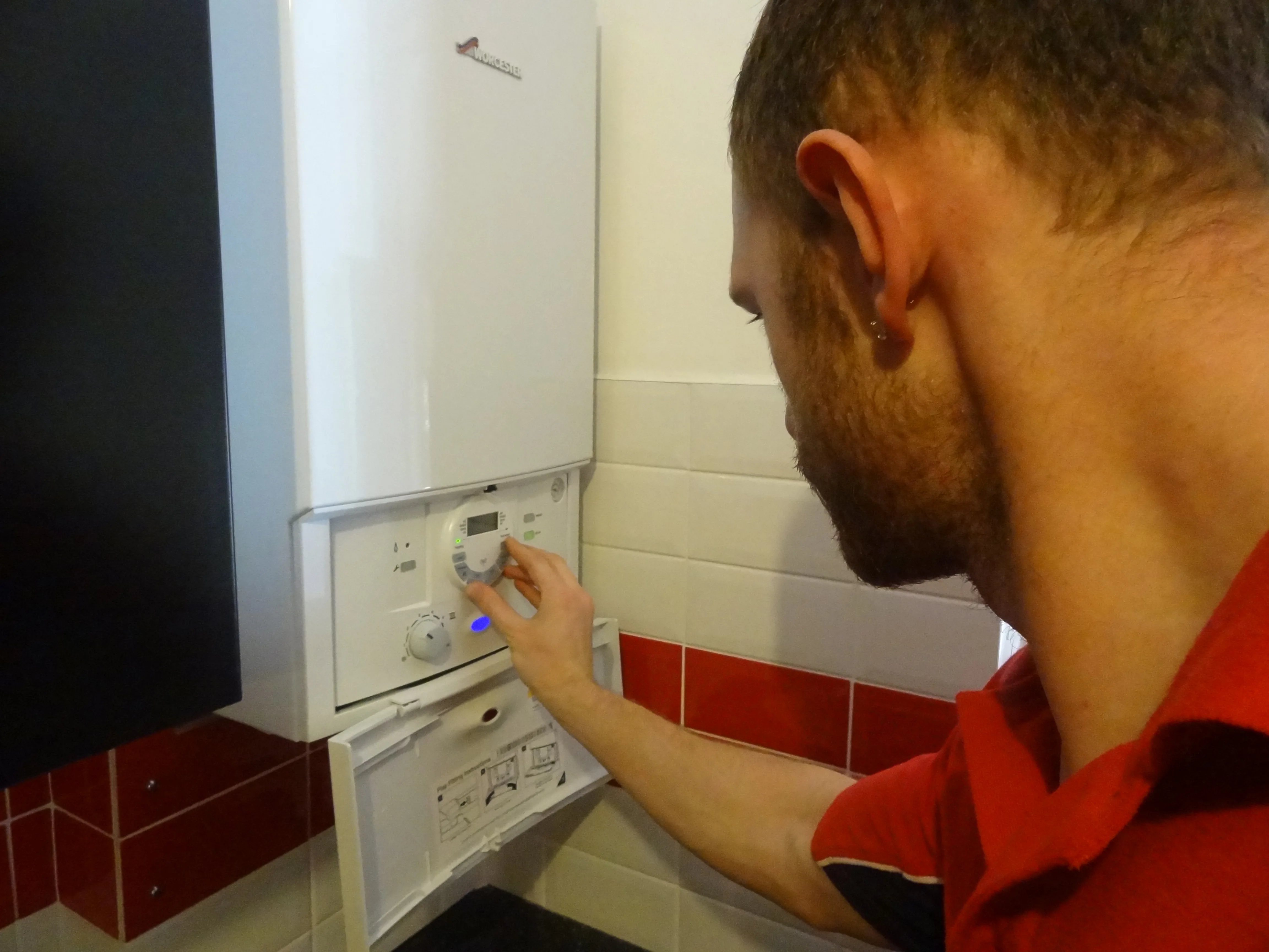 Chiswick Plumbers 247 engineer working on a boiler installation in Chiswick